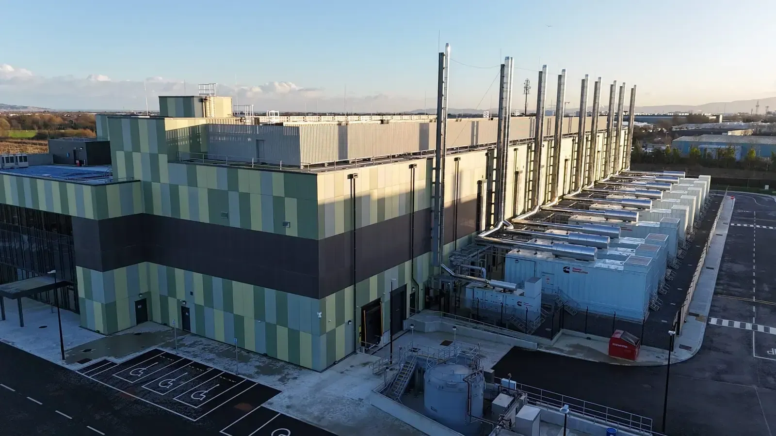 Aerial view of a completed data centre building envelope in Dublin with insulated panels and roof-mounted plant