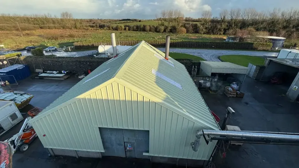 Drone view of a pitched insulated panel roof with rooflights on an industrial building in Ireland